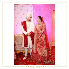 Coordinating the couple for their big day. The bride's classic red lehenga is perfectly complemented by the groom's custom sherwani and matching hand-embroidered red dupatta.