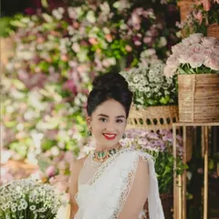 A client dressed for her Haldi ceremony in an unconventional and elegant white pearl and lace saree. This shows how custom design can reinterpret traditional event attire in a fresh and personal way.