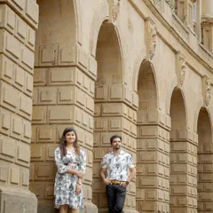 A stylish portrait using the grand colonial architecture of Mumbai as a backdrop. The strong lines of the arches create a powerful and sophisticated composition.