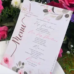 A beautifully designed menu for a 50th-anniversary lunch. Coordinating your stationery with the decor adds a sophisticated and cohesive touch to the event.