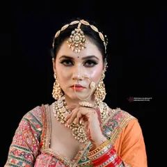 Radiating elegance in a beautiful orange and pink ensemble. This look is all about soft glam, with a focus on captivating eyes and luminous skin.