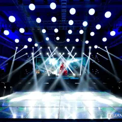 A cosmic-themed sangeet stage with a massive LED screen and a state-of-the-art lighting rig. We create concert-level experiences that transport guests to another world, complete with stunning visuals and effects.