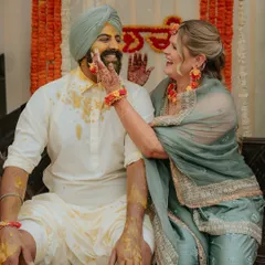 A playful moment during a Sikh wedding's Haldi ceremony. I love capturing these cross-cultural interactions and genuine smiles.