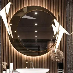 This bath area emanates opulence with its freestanding bathtub and a vanity that combines marble and veneer. The gold PVD finish lion emblem as a water sprout adds a touch of old-world luxury, balancing refined elegance with a contemporary aesthetic.