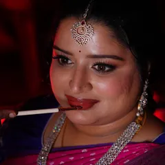 The final touch of lipstick. This close-up shows the beautiful glossy finish that completes her engagement makeup look.