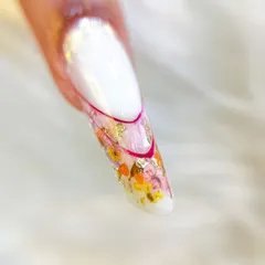 Another angle of the inbuilt floral design, showing the delicate pink line work that defines the clear tip.