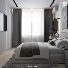 A modern bedroom design featuring a cool grey color palette, a comfortable upholstered bed, and a sleek, wall-mounted TV for a clean and uncluttered look.