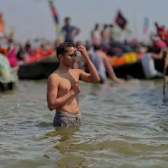 A moment of prayer and reflection after the holy dip in the Ganga. The water is not just water; it is a carrier of immense spiritual energy. I am bringing back this holy water for all my students who could not make it.