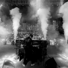 A powerful black and white image of CO2 jets firing on stage. These effects are essential for building hype and creating a dynamic visual show.