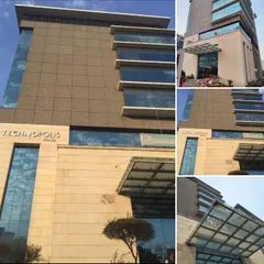 A collage of images from the Technopolis IT Hub. These different views highlight key architectural features, including the cantilevered window bays and the welcoming glass entrance canopy, which remain functional and stylish.