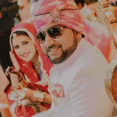 A candid moment of joy during a wedding ceremony in Jaipur. The groom's smile and the bride's happy glance show that even in the most regal settings, it's the genuine emotions that I love to capture.