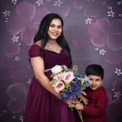 A sweet studio moment between a mother-to-be and her son. Including your children in your maternity photoshoot helps capture this unique moment in your family's story.