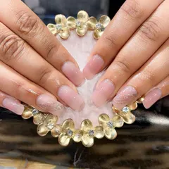 A beautiful result on natural nails. This client has a sheer pink gel overlay with a subtle touch of glitter for strength and style.