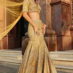 The mermaid-style lehenga is a fantastic choice for a reception. I can create a similar silhouette for you, embellished with intricate work for a truly glamorous feel.