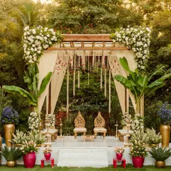 A beautiful blend of tradition and nature. We used banana leaf pillars, jasmine strings, and white florals to create this serene and elegant mandap for a classic South Indian Kalyanam.