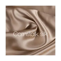 A swatch of cornstalk silk, a fabric I often use for its beautiful drape and subtle, natural sheen. The quality of the material is the foundation of every great suit.