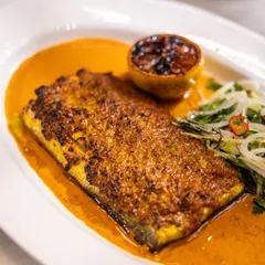 Fresh from our new menu, the Woodfire SeaBass is crispy, juicy, and oh-so-delicious. Served with a zesty sauce and charred lemon, it's a light yet satisfying main course.