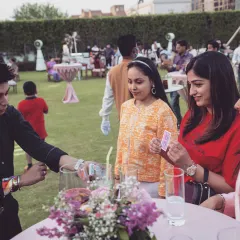 A perfect sangeet evening, moving between groups and breaking the ice with some close-up card magic. My goal is to get everyone mingling and laughing, making the event more interactive and fun for all your guests.