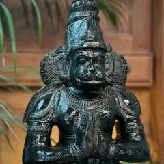 A standing Anjaneya (Hanuman) in Anjali mudra, handcrafted from black granite. This statue is a great addition to a foyer, garden, or zen space.