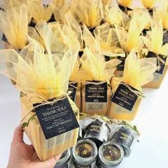 For a milestone 50th birthday, I created these sophisticated black and gold themed gift boxes. Each large 200ml jar candle was hand-poured with black soy wax, infused with a lavender lemongrass scent, and topped with golden glitter for a touch of elegance.