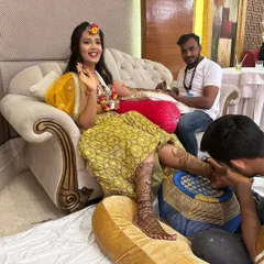 My team and I working on a bride, including her feet mehndi. For large events, we ensure every detail is perfect, providing full coverage for both hands and feet.
