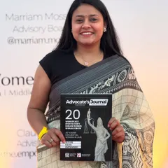 Holding the Advocate's Journal, which named me one of the 20 Young Influential Women in Law. This recognition strengthens my resolve to work for justice and legal awareness.