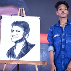 This is my tribute to the legend, Puneeth Rajkumar. Creating portraits of beloved icons live on stage is my way of honoring their legacy and sharing that moment with the audience. It's a powerful experience for everyone involved.
