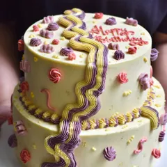 A fun, two-tiered birthday cake designed for a kid's celebration. We love getting playful with colours and designs while keeping the cake itself delicious with our signature buttercream frosting.
