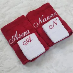 You can't go wrong with a classic red and white combination for a soon-to-be-married couple. This set includes bold red bath towels for 'Asma' and 'Nawaz' and contrasting white hand towels with their initials.