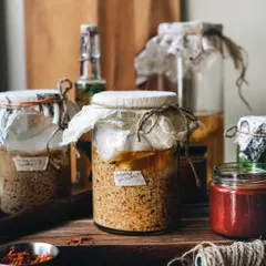 The final shot from my sourdough series, featuring homemade fermented sauces and pastes in rustic jars, telling a story of loving craft.