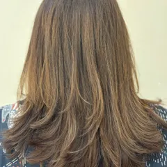 The back view of a precision-layered haircut. You can see how the layers are stacked to create shape and texture.