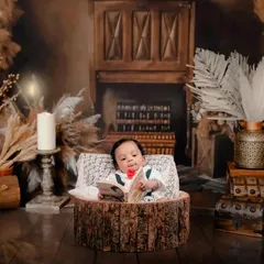 A different perspective from our library-themed session, this time with a rustic fireplace backdrop. I can adjust the setup to create a variety of beautiful images from a single themed concept.