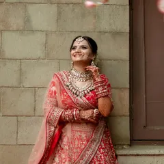 This bride wanted a royal wedding look, and we delivered. Dressed in a stunning red lehenga, her makeup was all about timeless elegance, perfect for a grand entrance.
