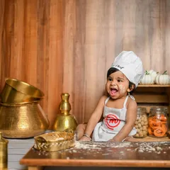 A 'Little Chef' themed cake smash for a first birthday. It's a unique and fun alternative to a traditional setup, and the photos are always full of personality.