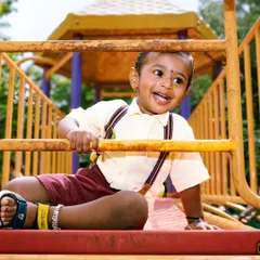 The pure, unfiltered joy of childhood is what I aim for in my kids' photography sessions. This little guy's laughter at the park made for a perfect, energetic shot that the family will cherish forever.