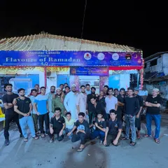 Our hardworking team in front of our decorated venue. We are a family, and we work together to bring you the best experience.