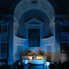The beautiful architecture of All Souls NYC, bathed in blue light for our 'Sitar for Mental Health' gathering. The venue is a crucial part of the experience, and this historic church provided a serene and sacred-feeling space for our musical meditation.