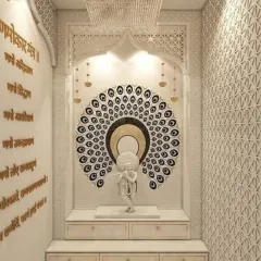 We designed this magnificent pooja room with intricate floor-to-ceiling marble jali work. The space is anchored by a large peacock feather mandala and a Krishna idol, with a crystal chandelier and engraved mantras enhancing the divine atmosphere.
