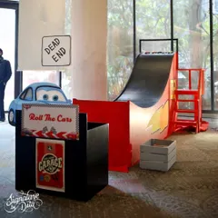 A 'Roll The Cars' ramp game was a perfect activity for the Cars-themed party. It's a simple, fun game that I designed to fit perfectly with the overall garage and racing aesthetic.