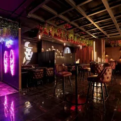 Another angle of the Harmony Inn project, showcasing how different lighting colors and effects can be used to define zones and create a vibrant, modern atmosphere in a commercial setting.
