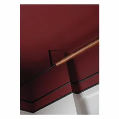 To avoid a false ceiling, we designed this custom lighting solution where a wooden rod wraps around a metal rod. It provides a source of indirect light, casting a dim glow onto the Marsala-colored ceiling and acting as a minimalist sculptural piece.