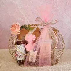 A beautiful wireframe basket in a lovely golden hue, filled with our handmade treats and wrapped in pink tulle. A perfect gift for her.