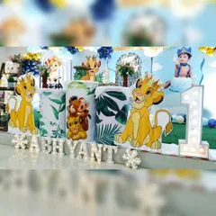 A closer look at the personalized details for Abhyant's Lion King party. We've included marquee letter's spelling out the name, character cutout's of Simba and Timon & Pumbaa, and a large light-up number '1'.