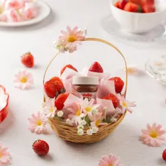 The perfect duo in a basket. This simple yet charming gift includes fresh strawberries and a jar of Nutella, decorated with flowers. It's a made-to-order treat for any strawberry lover.