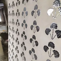 Here you can see the Thikri panel taking shape. Each piece of glass is carefully placed by the artisan, slowly building the floral motif. It is a testament to the patience and skill passed down through generations.