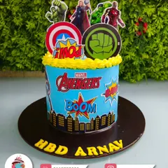 Assemble the team for a super birthday with this Avengers-themed cake. It features the Hulk, Thor, and Iron Man, complete with the iconic Avengers logo, perfect for your little hero.