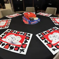 We believe in making every detail count. This table was set up for fun, with custom-printed dice-themed placemats and a stack of board games, ensuring there were interactive elements for every guest to enjoy.