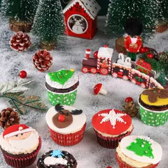 A close-up of the adorable Christmas-themed cupcakes, showcasing the detailed fondant work of Santa, reindeer, and snowflakes.