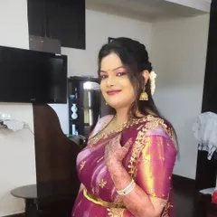 A candid shot of Kalyani. The makeup is fresh and radiant, perfect for a day wedding or event.