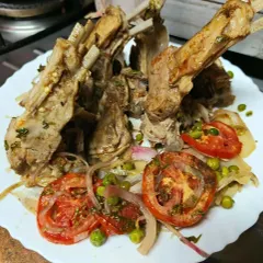 Succulent baked lamb chops, seasoned with a blend of herbs and spices. This dish is a popular choice for a hearty and elegant Iftar feast, served with a side of fresh salad.